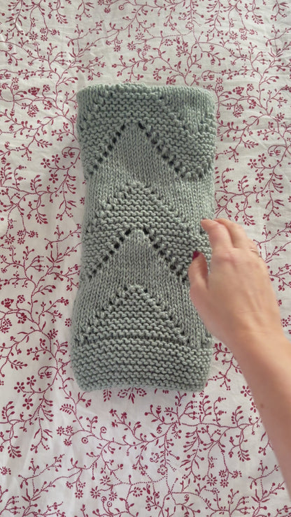 diamond baby blanket knitting pattern video showing textured knit in movement
